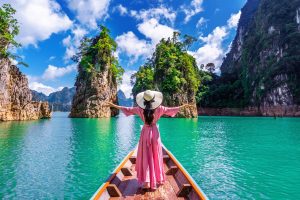 beautiful-girl-standing-boat-looking-mountains